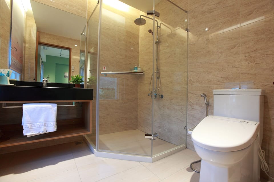 Standard Quadruple Room, 2 Double Beds, Balcony, River View | Bathroom | Shower, rainfall showerhead, free toiletries, hair dryer
