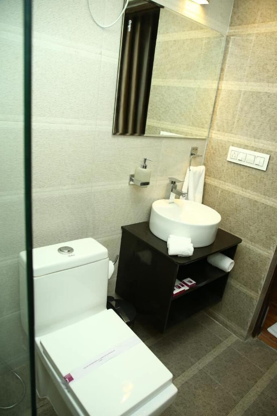 Shower, designer toiletries, hair dryer, towels