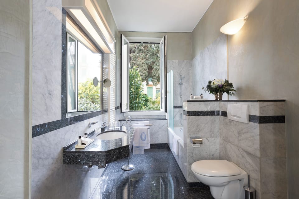 Eco-friendly toiletries, hair dryer, bidet, towels
