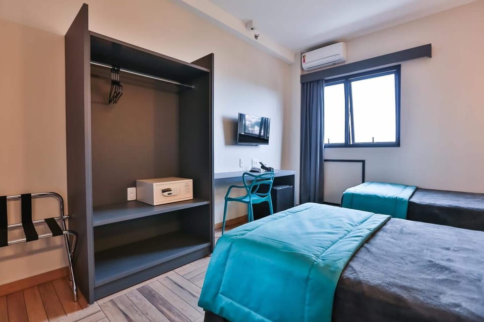 Standard Room, 2 Twin Beds | Minibar, in-room safe, desk, laptop workspace