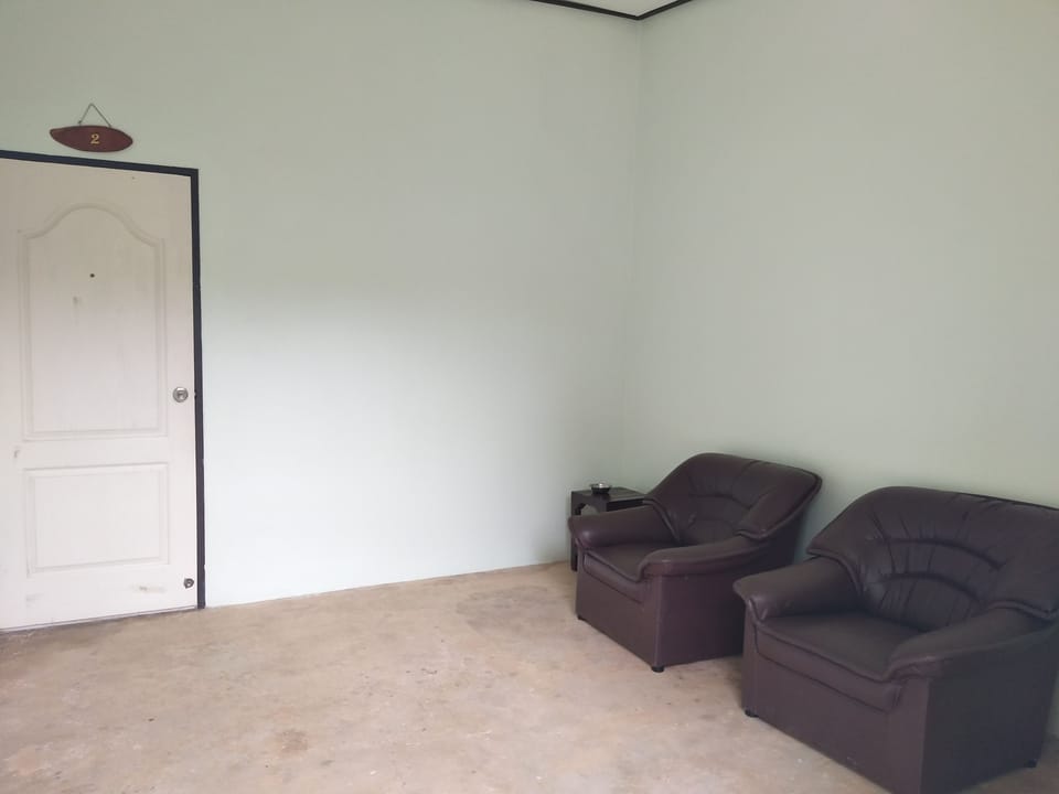 Standard Double Room | Living area | Flat-screen TV