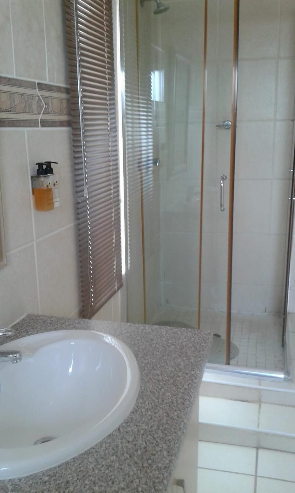 Separate tub and shower, deep soaking tub, free toiletries, towels