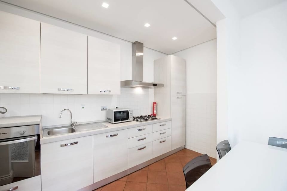 Basic Apartment, 3 Bedrooms | Private kitchen | Full-size fridge, microwave, stovetop, coffee/tea maker