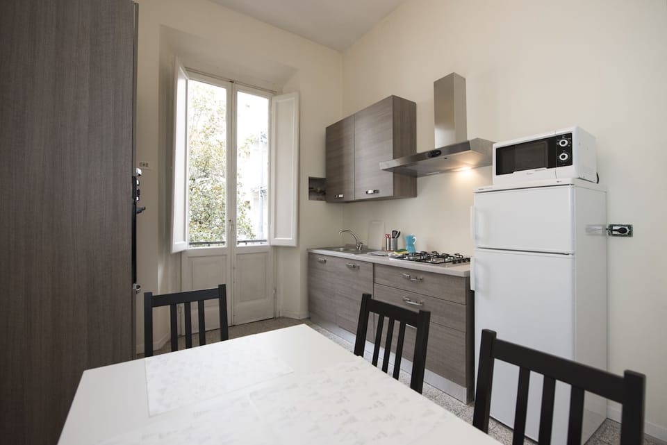 Basic Apartment, 4 Bedrooms | Private kitchen | Fridge, microwave, coffee/tea maker, cookware/dishes/utensils