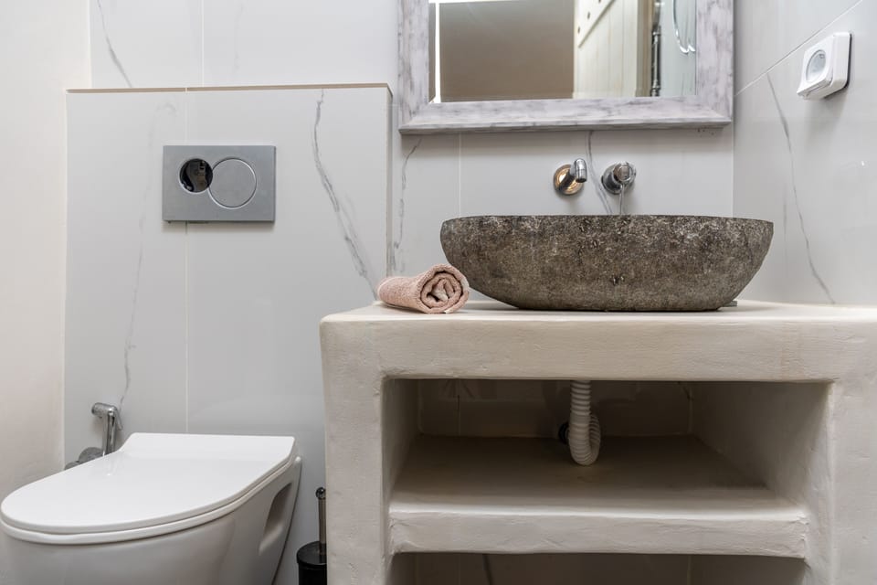 Economy Quadruple Room, Kitchenette, Ground Floor | Bathroom | Shower, hair dryer, bathrobes, bidet