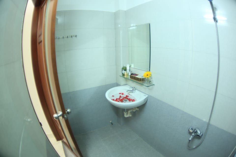 Shower, free toiletries, hair dryer, slippers