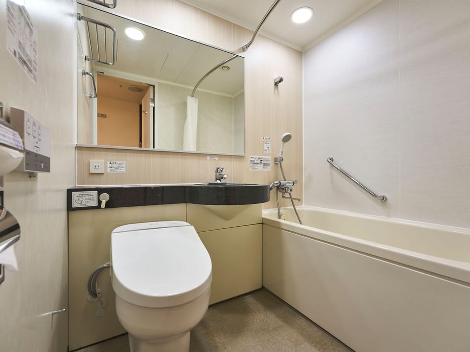 Combined shower/tub, free toiletries, hair dryer, slippers