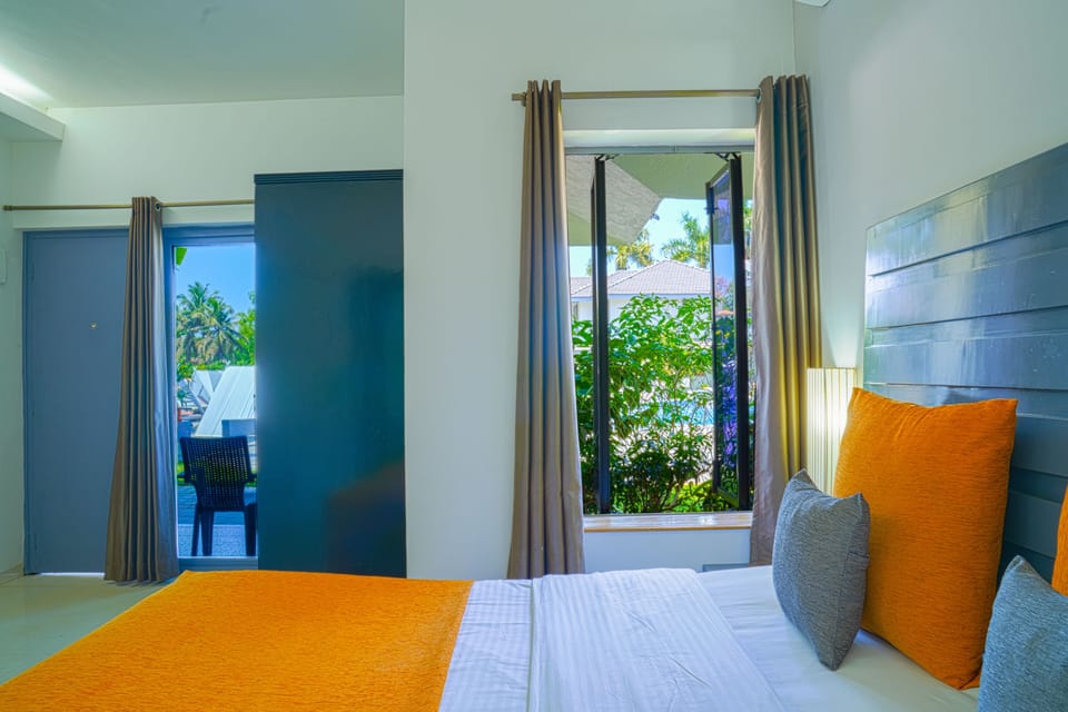 Superior Pool View Room | Minibar, in-room safe, desk, blackout drapes