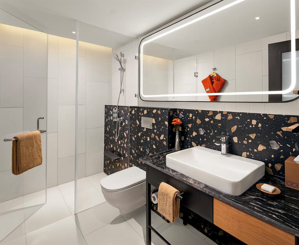 Eco-friendly toiletries, hair dryer, bathrobes, slippers