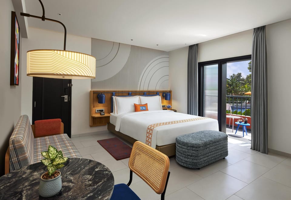 Deluxe King room with Balcony and Pool view | Premium bedding, down comforters, memory foam beds, in-room safe