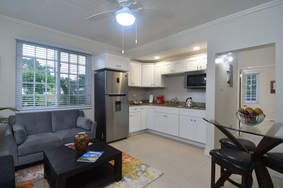 Executive Villa, 1 Bedroom, Garden View | Living room | 50-inch flat-screen TV with cable channels, TV, DVD player