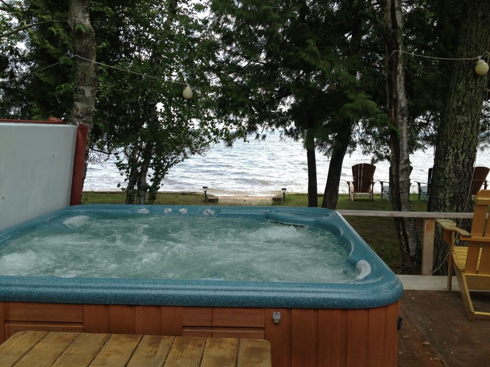 NEW FEATURE: Enjoy a hot tub that is built in to the deck with a view of Big Bay