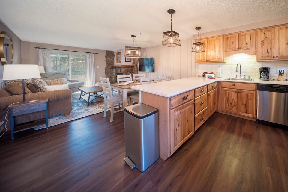 Unwind in your open-concept retreat where warm wood cabinets and granite counters create the perfect space for cooking and gathering together.
