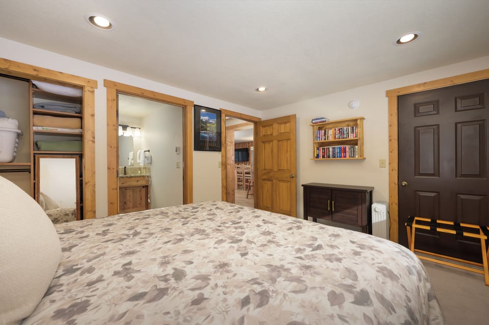 Unwind in your spacious bedroom with warm wood accents and built-in shelving for your favorite books.