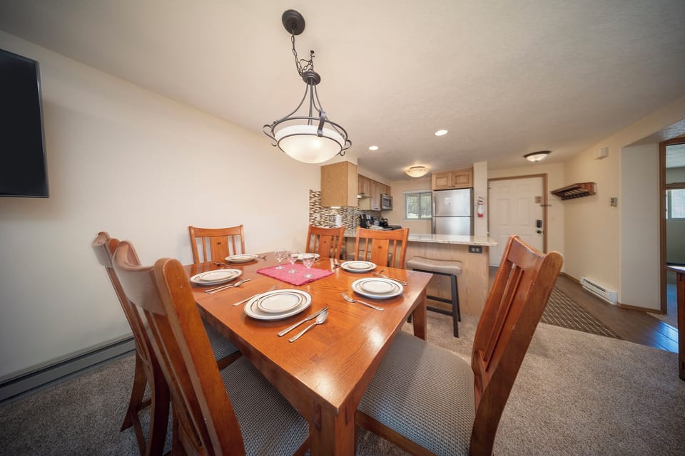 Gather around your spacious dining table for memorable meals with family and friends in this open-concept space.