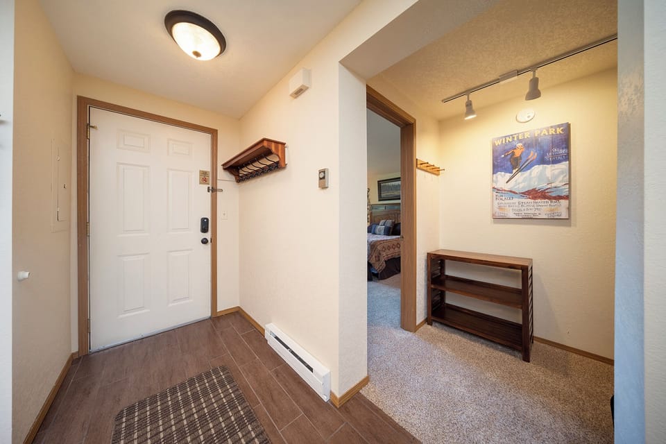 Step inside your welcoming entryway with convenient ski storage and easy access to cozy bedrooms.