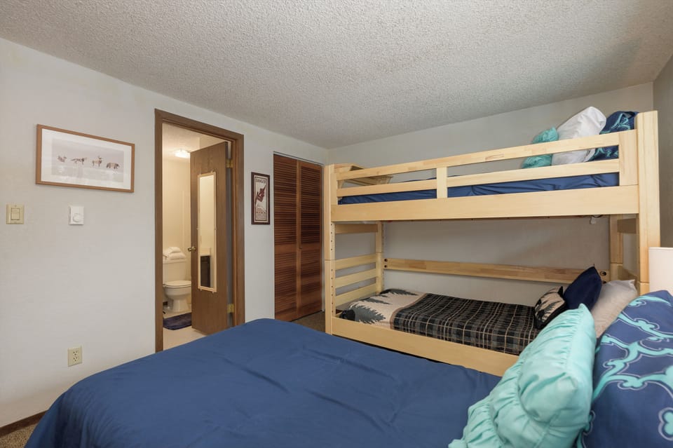 Your cozy bedroom features comfortable beds and bunk beds, perfect for families. Fresh linens await your restful nights together.