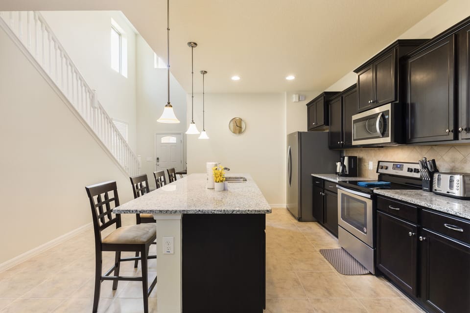 Fully equipped kitchen with new stainless steel appliances, granite countertop