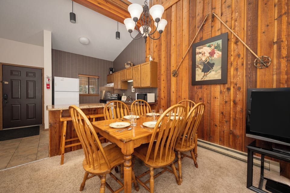 Your cozy mountain dining space features warm wood accents, rustic charm, and everything you need for memorable family meals together.
