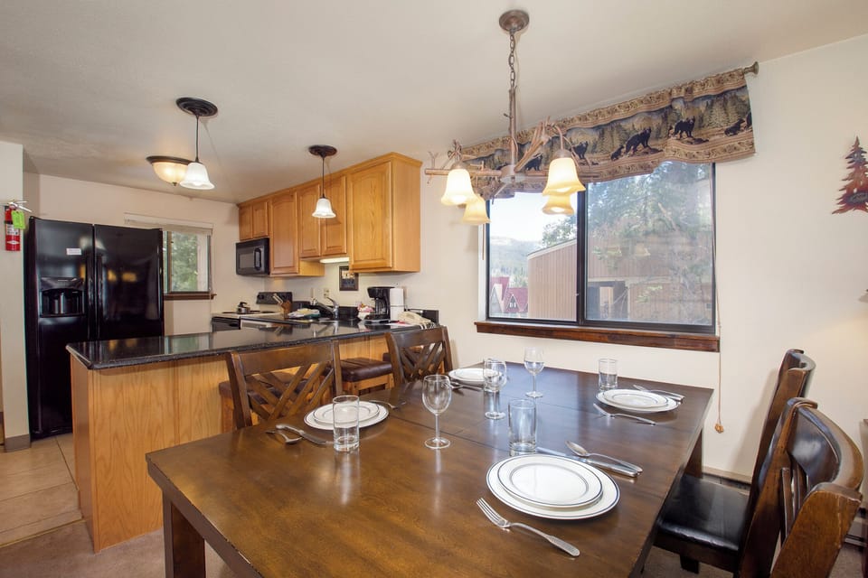 Your fully-equipped kitchen and dining area awaits with everything needed to create memorable meals together.