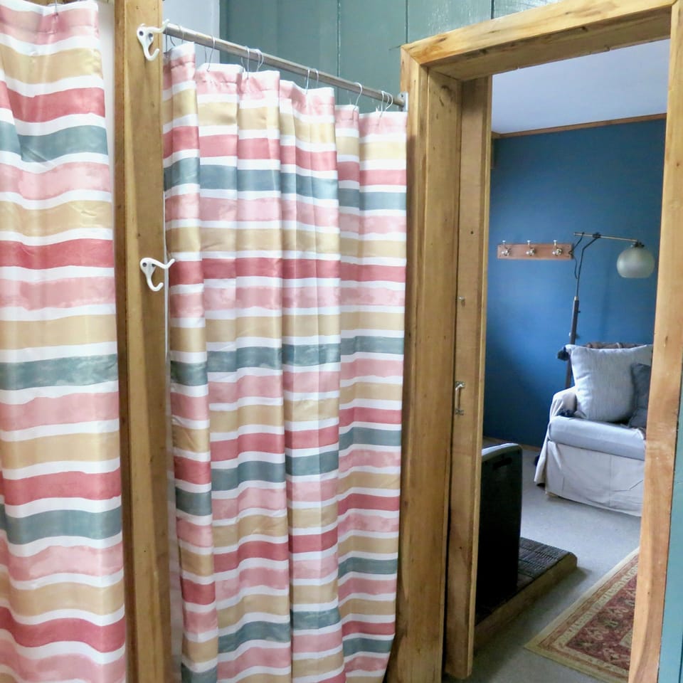 Besides the shower, there is also a closet to hang clothes