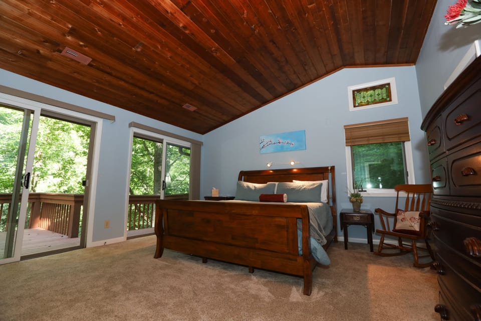 Primary bedroom with king bed and walk out patio doors to the front balcony!