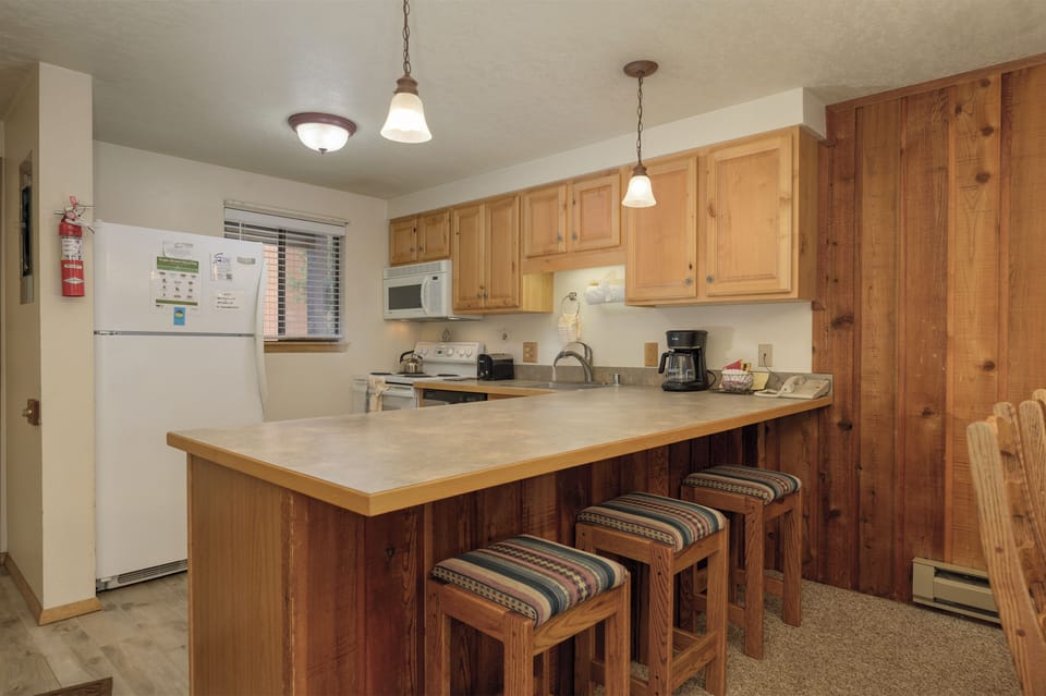 Cook and connect at your spacious kitchen island, complete with modern appliances and cozy bar seating for memorable meals together.