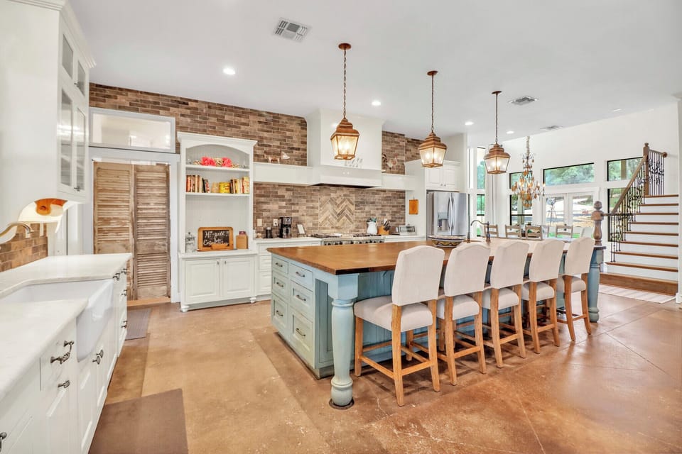 Charming pendant lights and rustic brick accents