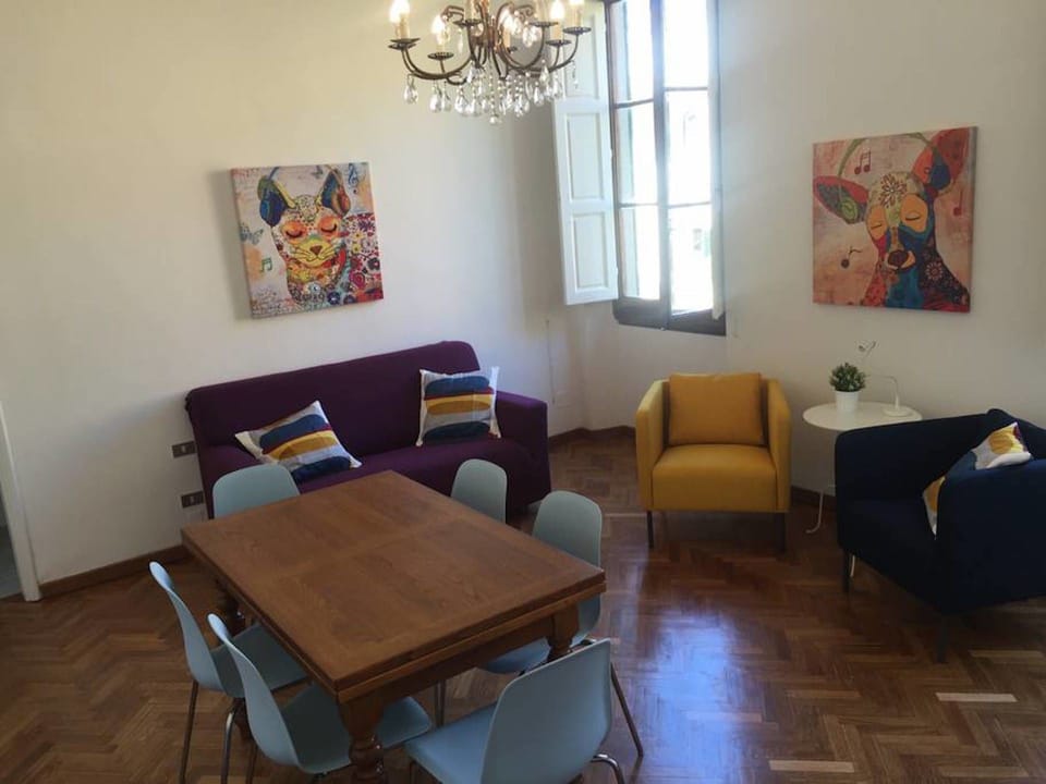 Basic Apartment, 4 Bedrooms | Living area | Flat-screen TV