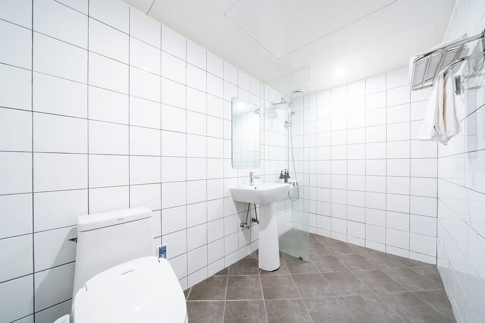 Standard Double Room | Bathroom | Designer toiletries, hair dryer, bathrobes, slippers