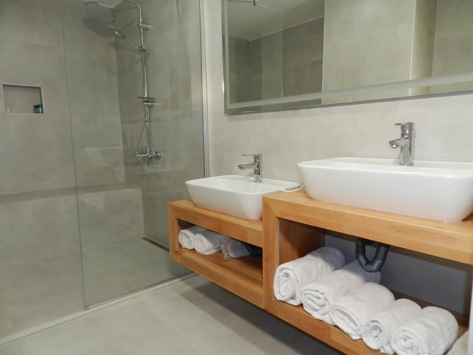 Shower, free toiletries, hair dryer, slippers