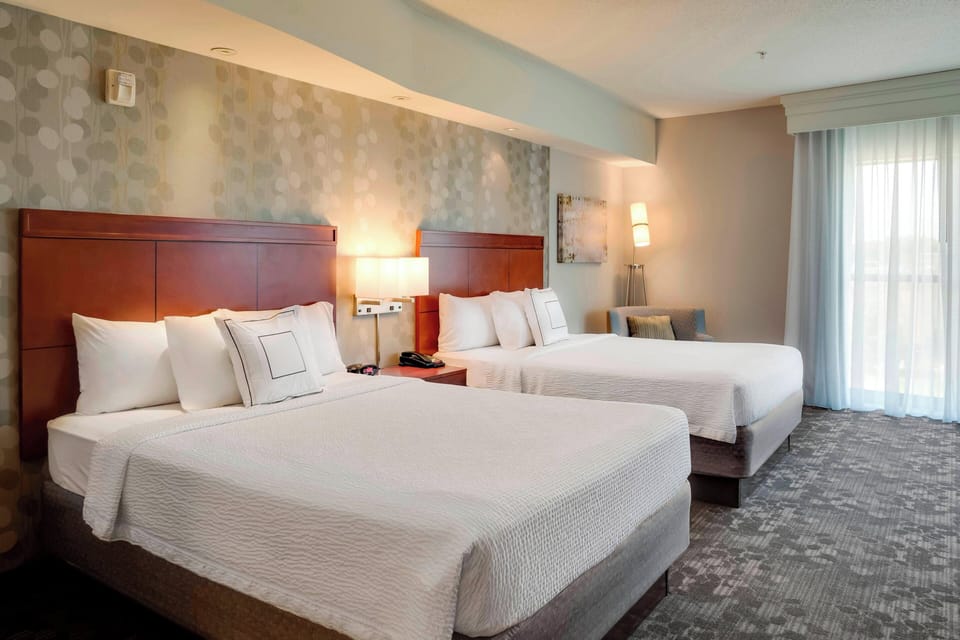 Premium bedding, pillowtop beds, desk, blackout drapes