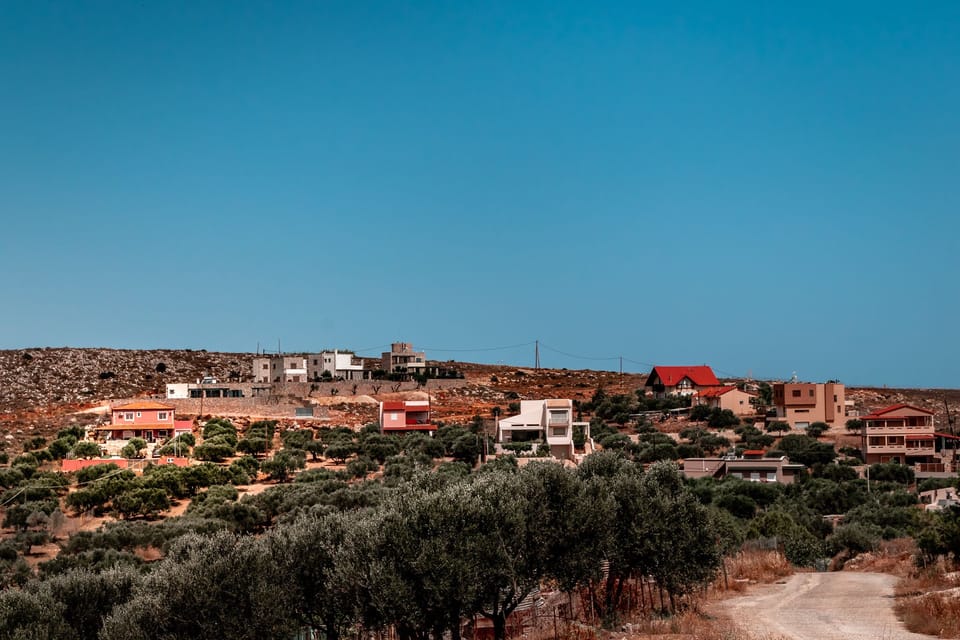 View from the Road, we are the terracotta pink house on the far left.