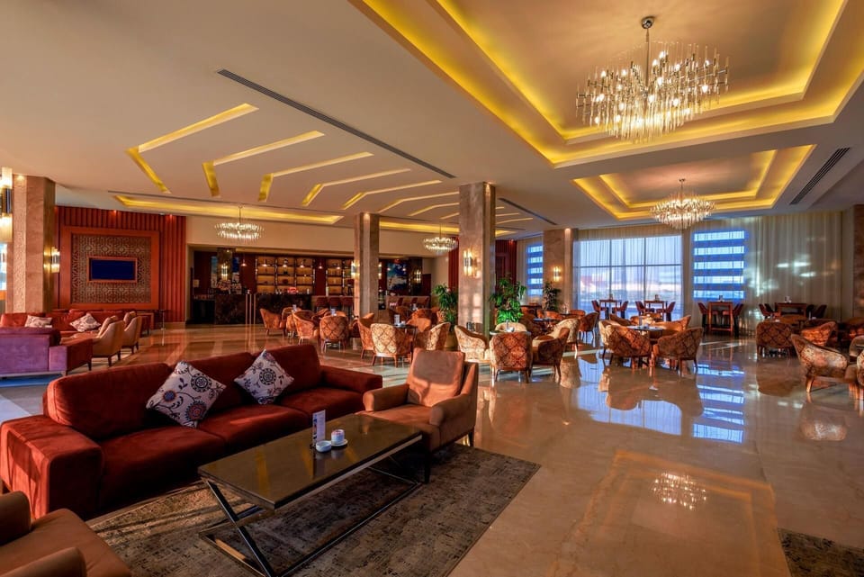7 bars/lounges, 3 poolside bars, beach bar