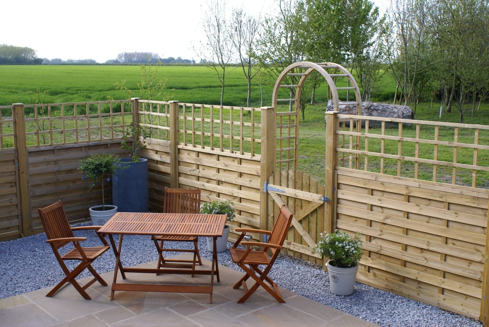 Private patio garden with views over fields and woodland
