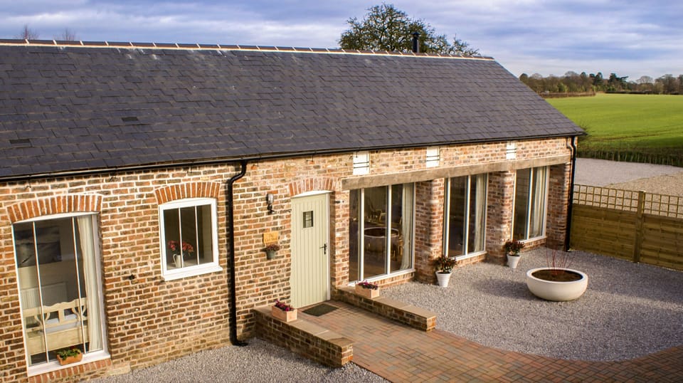 Stunning conversion from old cart shed in open countryside