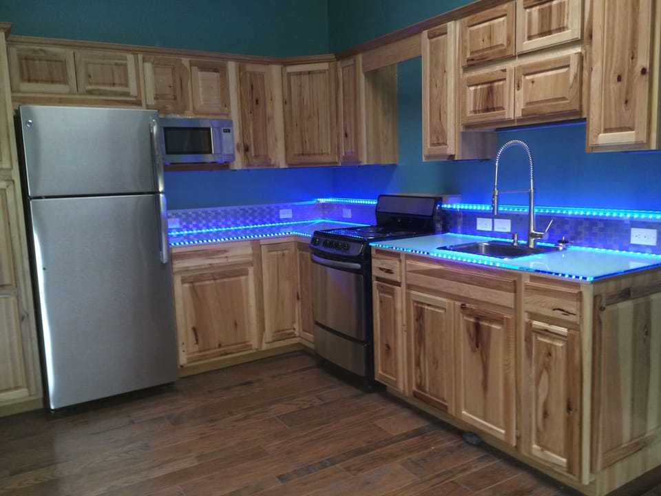 Kitchen with glass L.E.D. lit counter tops