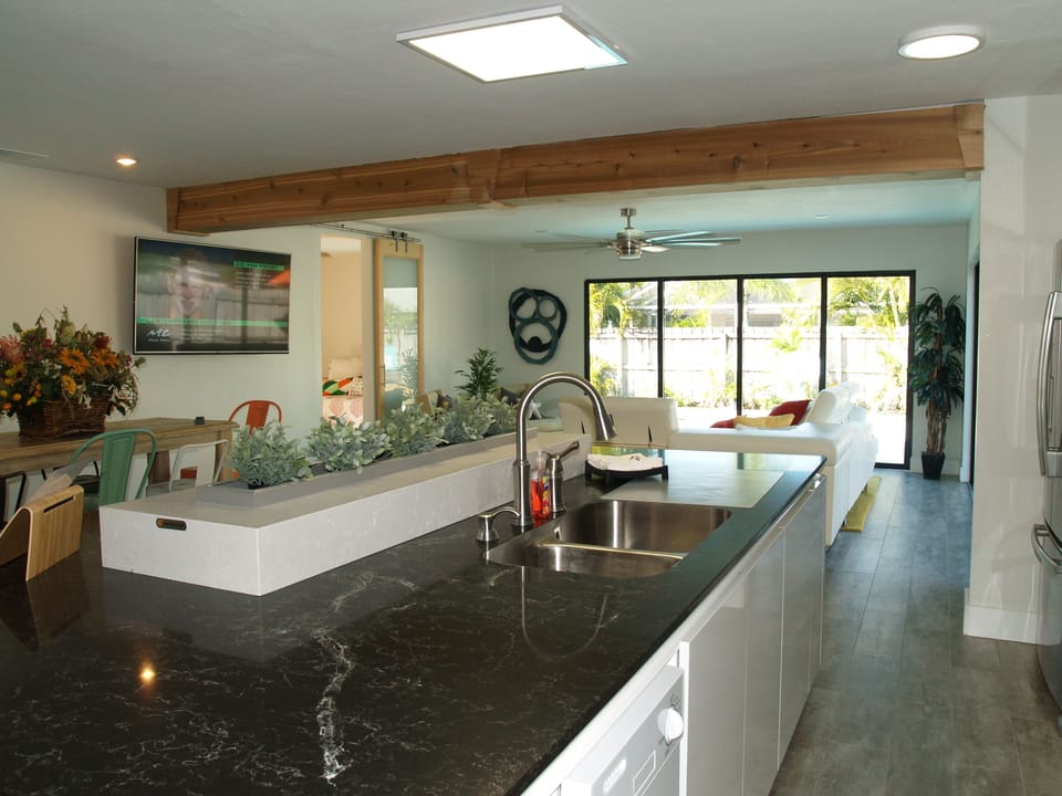 View from kitchen to living and through to the pool.
