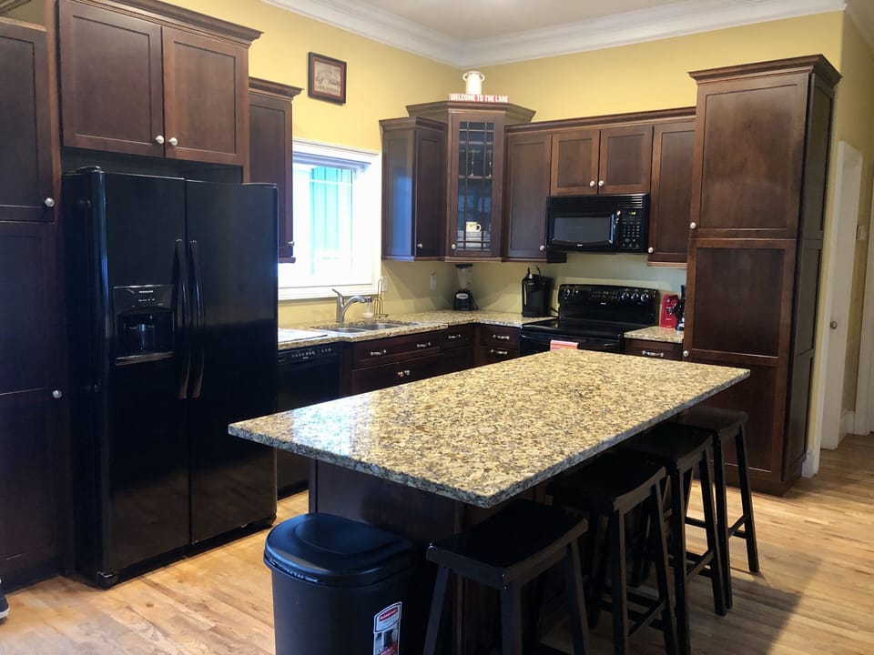Kitchen has bar seating for 4 & plenty of culinary necessities, plus a Keurig.