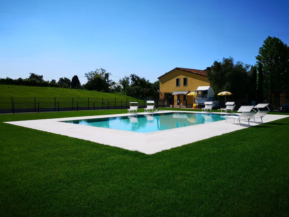 Seasonal outdoor pool, open 8:30 AM to 6:30 PM, pool umbrellas