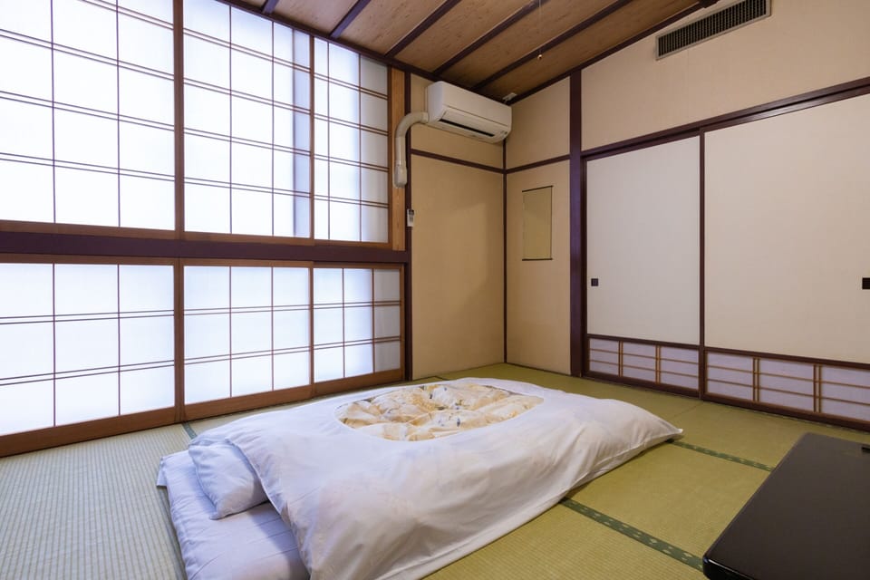 Japanese-style Room with Share Bathroom - Triple, Smoking | In-room safe, desk, WiFi (free), bed sheets