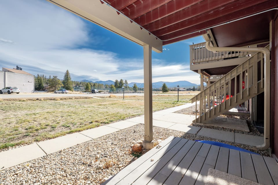 Your private covered patio offers peaceful mountain views and direct walkway access, perfect for morning coffee or evening relaxation.