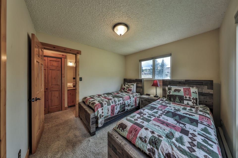 Drift off in your cozy twin bedroom with rustic charm and wilderness-themed bedding that brings nature indoors.