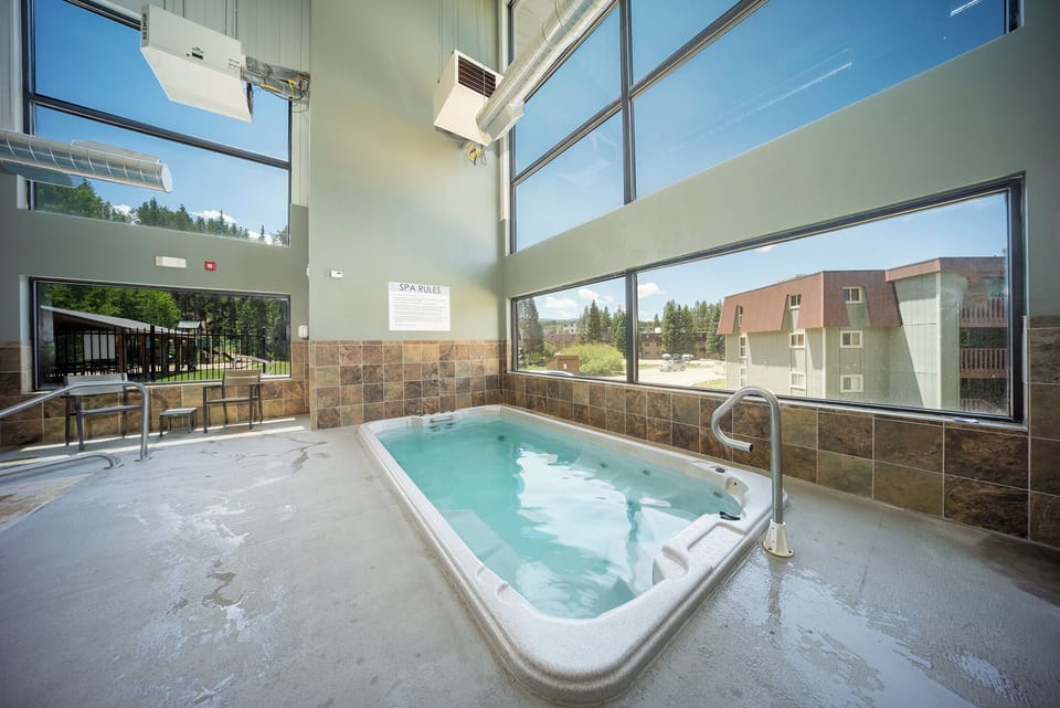 Soak your stress away in this stunning spa hot tub surrounded by floor-to-ceiling windows and natural light.