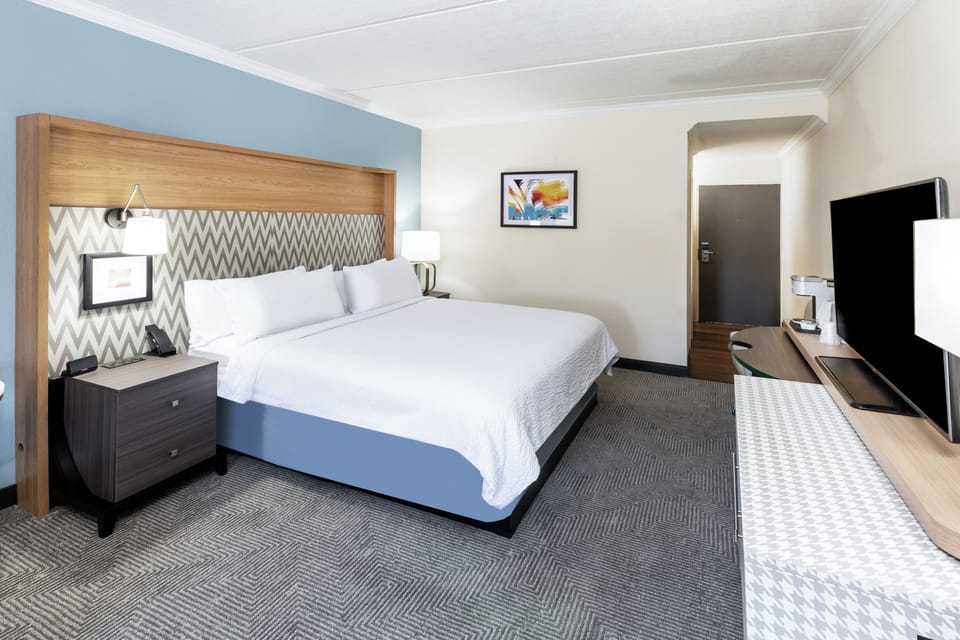 Premium bedding, down comforters, Tempur-Pedic beds, desk