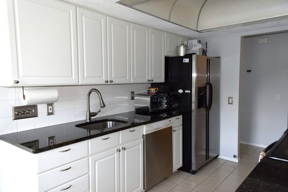 Galley Kitchen with granite counters and toaster oven