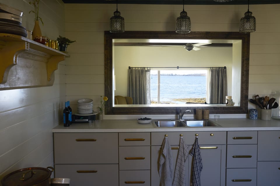The kitchen is open to the living and dining spaces and has the same killer view
