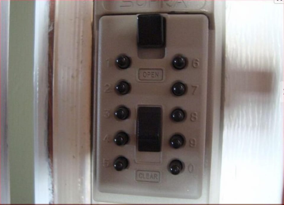 Keypad -punch the code and remove the face plate to get the key.