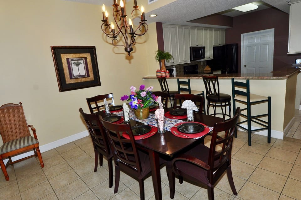 Dining table seats 6 with additional seating at the breakfast bar