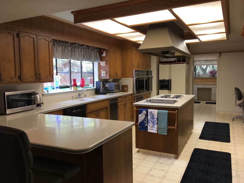 Kitchen with double ovens, warming drawer.